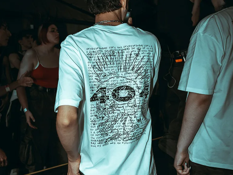 Glow-in-the-dark UV reactive concert branding on apparel