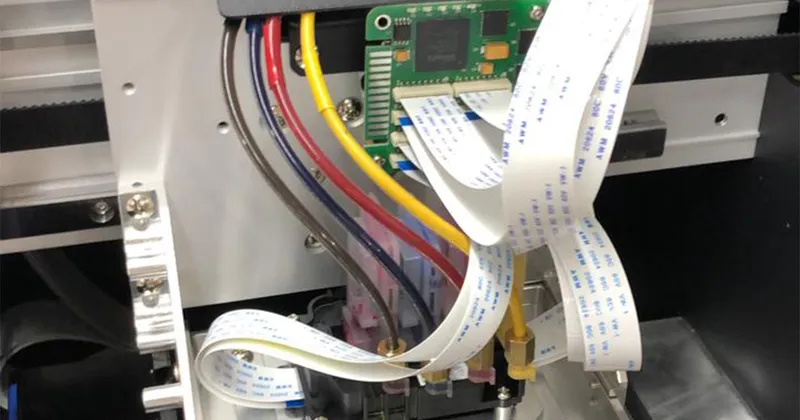 Epson 4720 printhead installed in carriage with third-party decryption card adapter and flat ribbon cables