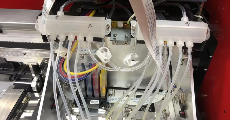 Genuine Epson i3200 printhead carriage with dual ink manifolds, sub-tanks, and dampers on Megajet DTF printer