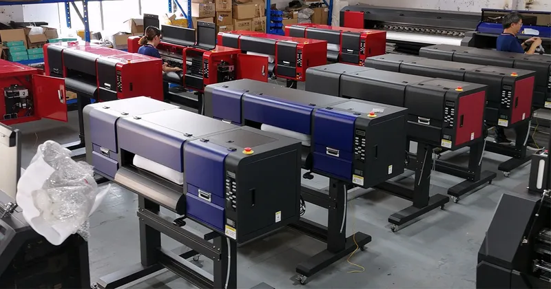 Megajet industrial 60 cm multi-head i3200 DTF printer line operating with automated powder shaker and curing dryer