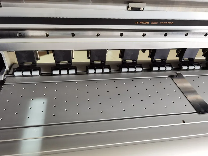 Industrial vacuum platen, high-density pinch rollers, and carriage drive assembly on a high-speed dye-sublimation printer